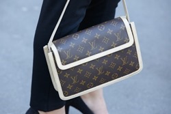 PARIS - SEPTEMBER 30: Louis Vuitton bag before Rochas show, Paris Fashion Week Day 2, Spring / Summer 2016 street style on September 30, 2015 in Paris.