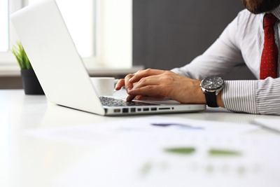 businessman typing on keyboard